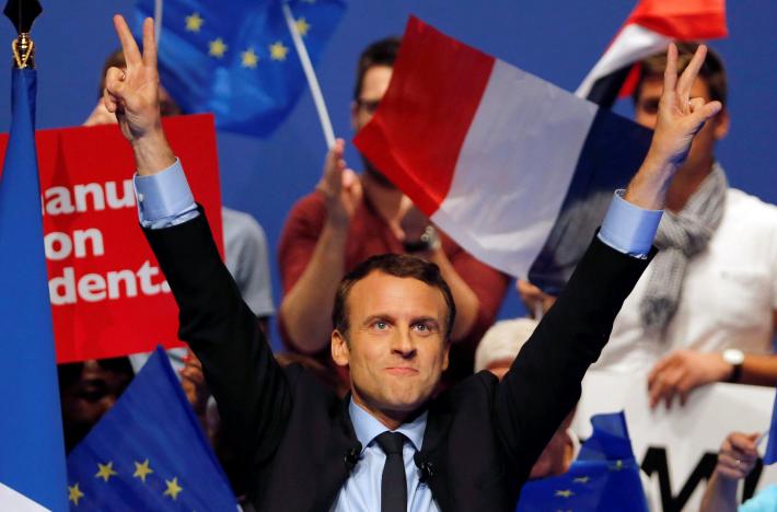 Emmanuel Macron, head of the political movement En Marche! and candidate for the 2017 presidential election, waves to supporters at the end of a campaign rally in Pau