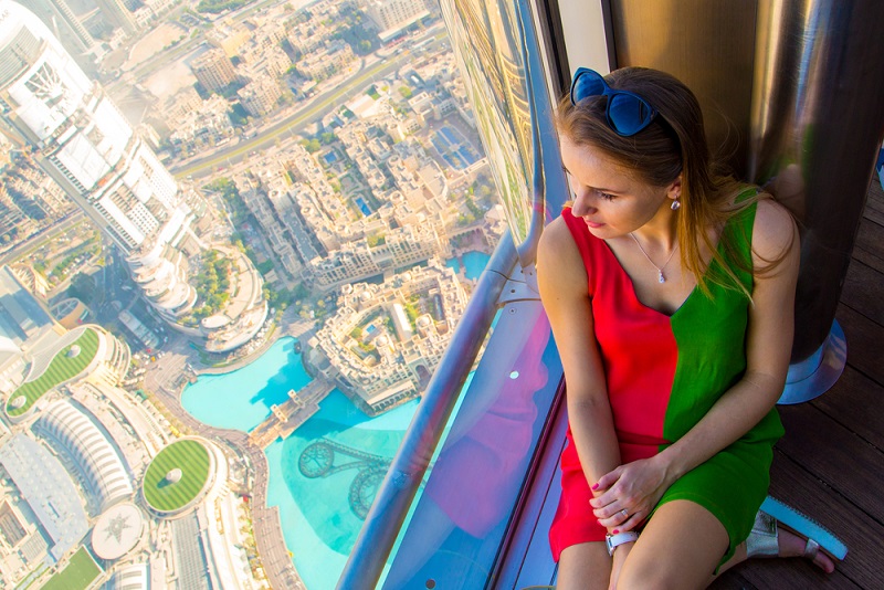 Dubai's Burj Khalifa and woman looking down