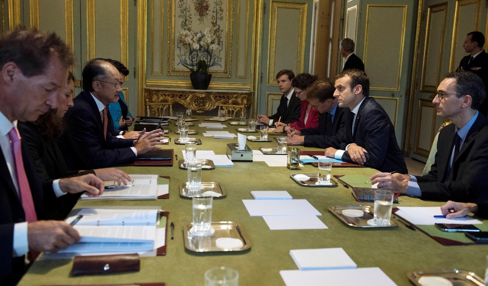 French President Emmanuel Macron and World Bank Group President Jim Yong Kim attend a meeting at the Elysee Palace in Paris