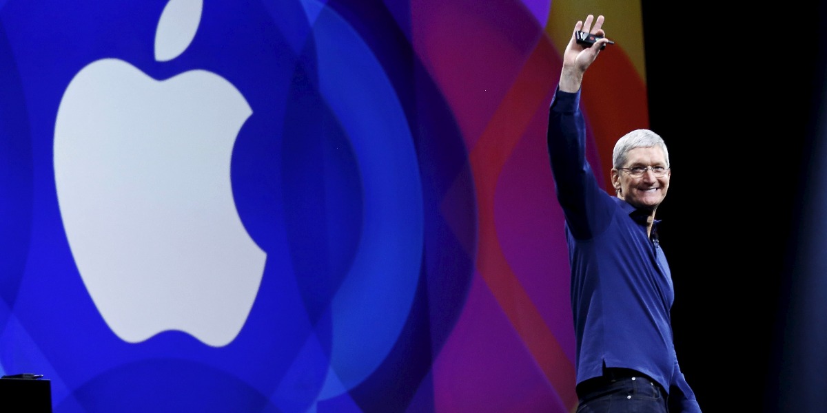 Apple CEO Tim Cook waves as he arrives on stage to deliver his keynote address at the Worldwide Developers Conference in San Francisco