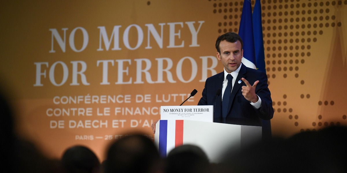 French President Emmanuel Macron gives a speech as part of an international conference