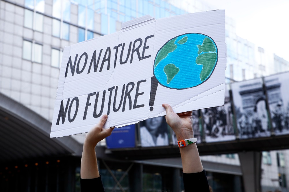 Activists during a demonstration to demand an action on climate change in front of European Parliament